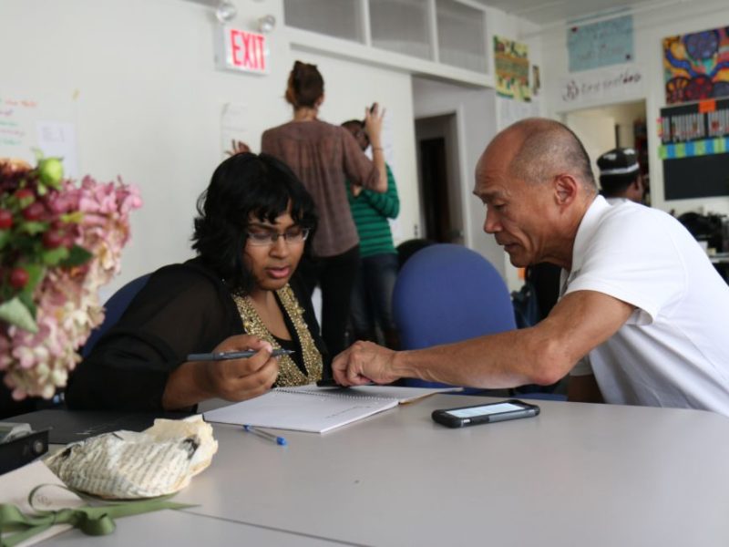 Monica Melton followed Don Kao, a Chinese American LGBT activist, around for weeks on an assignment from New York Times photo editor James Estrin. Melton captured this moment of Don helping a woman fill out paperwork. It exemplifies how hands on and willing to help Don is, especially among LGBTQ youth.