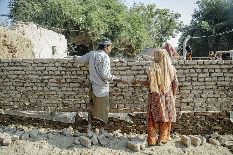 Locals rebuild their home in the south eastern city of Daddu, Pakistan after the 2022 floods.