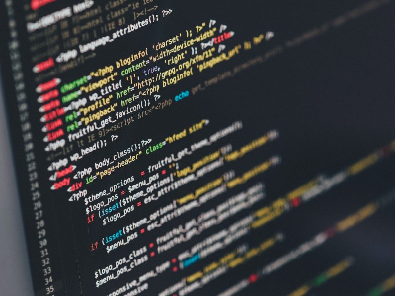 Monitor showing HTML in a text editor