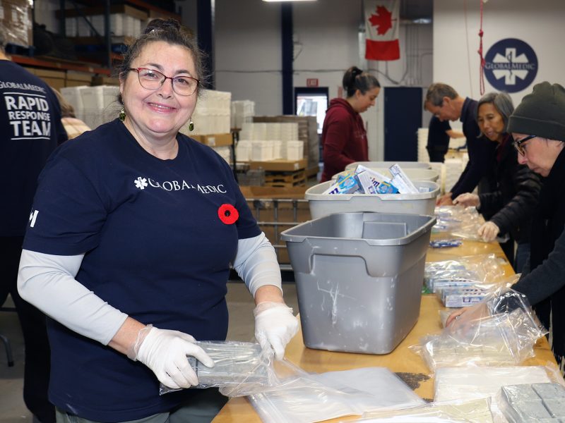 Volunteers pack kits at Global Medic in Etobicoke.