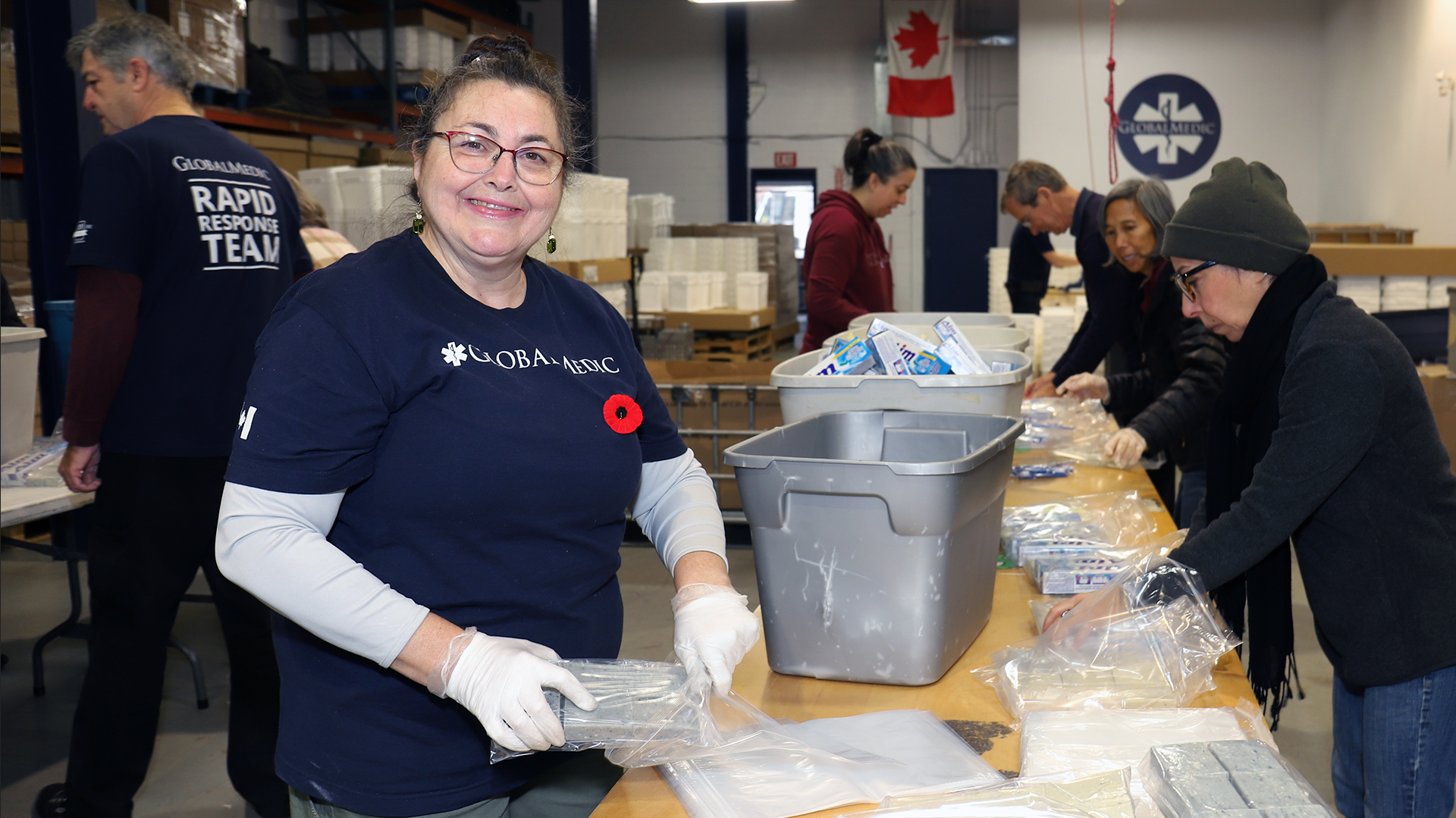 Volunteers pack kits at Global Medic in Etobicoke.