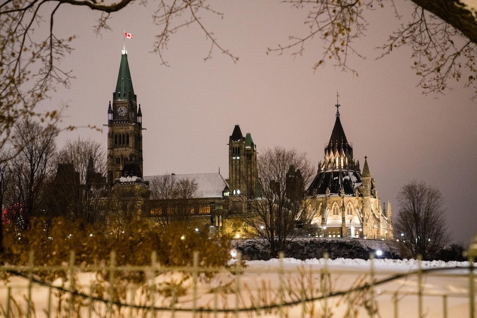 Lights illuminate Parliament Hill in Ottawa, Ont. Before the winter holidays, the Canada Revenue Agency released new guidance, which some say will help accelerate the flow of money to non-profits and grassroots groups. (Naveen Kumar / Unsplash)