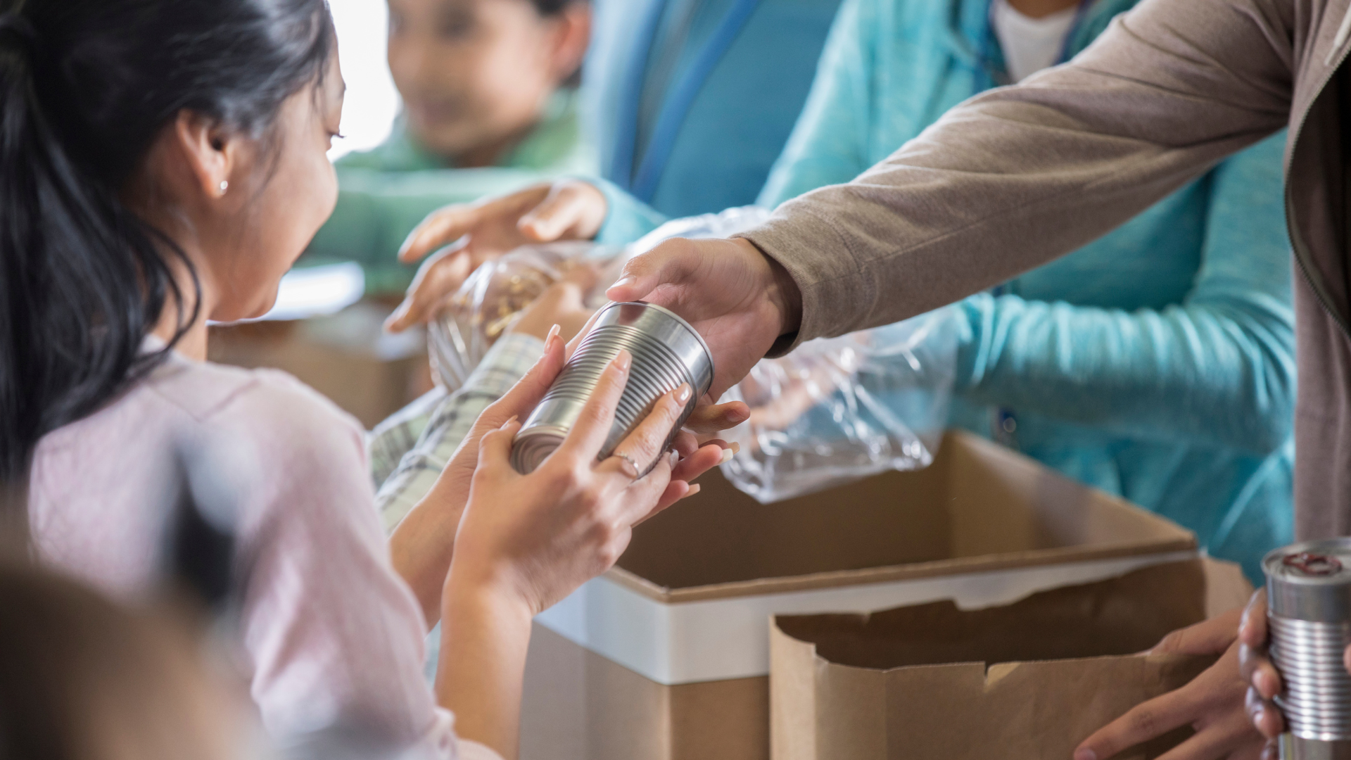 A child is receiving food at a food bank.