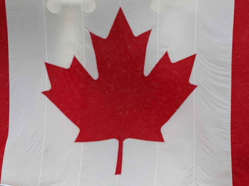 A Canadian flag hangs from the Manitoba Legislative Building in Winnipeg.