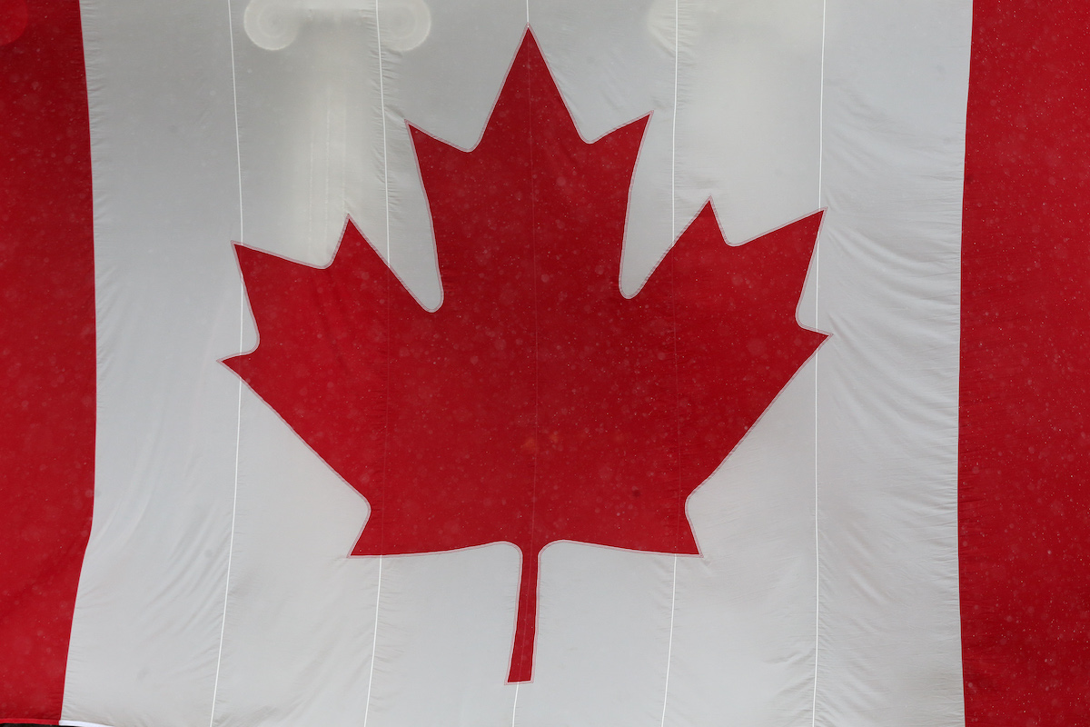 A Canadian flag hangs from the Manitoba Legislative Building in Winnipeg. 