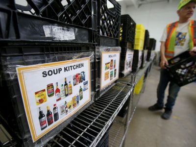 Volunteers sort donations at Harvest Manitoba. (Shannon VanRaes/Future of Good)