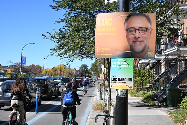 An election poster along a cycling path