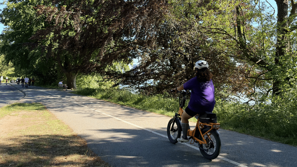 A cyclist uses a recreational trail in Vancouver’s Stanley Park, one of the parks where AccessNow tracking is available. (Abigail Turner/Future of Good)